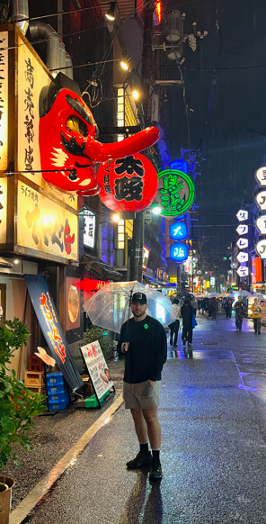 Nick in street umbrella